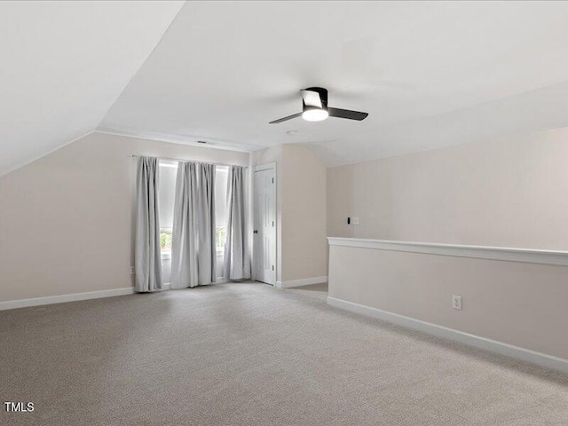 1662 Beechaven Rd, Fuquay Varina, NC 27526 - additional living space with lofted ceiling, a ceiling fan, baseboards, and light colored carpet