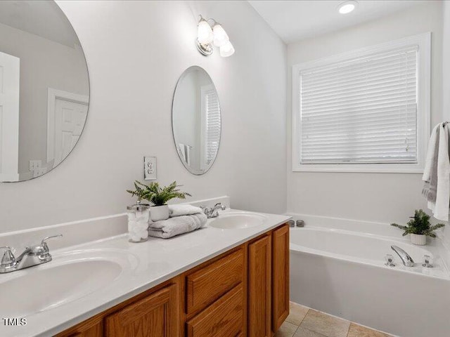 1662 Beechaven Rd, Fuquay Varina, NC 27526 - bathroom with double vanity, a bath, and tile patterned floors