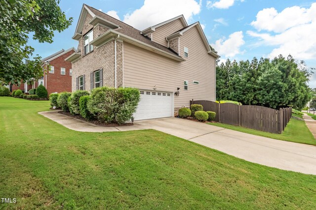200 Vintage Hill Cir, Apex, NC 27539 - view of side of home featuring driveway, brick siding, and an attached garage