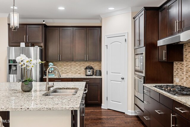200 Vintage Hill Cir, Apex, NC 27539 - kitchen featuring appliances with stainless steel finishes, a sink, dark brown cabinets, light stone countertops, and dark wood-type flooring