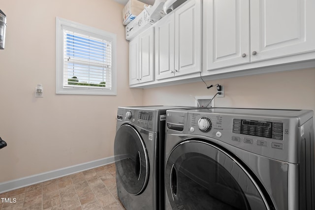 200 Vintage Hill Cir, Apex, NC 27539 - laundry area with baseboards, cabinet space, washing machine and clothes dryer, and stone finish floors