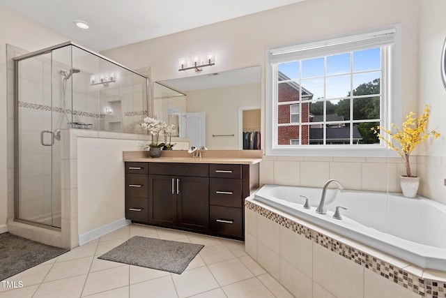200 Vintage Hill Cir, Apex, NC 27539 - full bathroom with vanity, a garden tub, a stall shower, and tile patterned floors