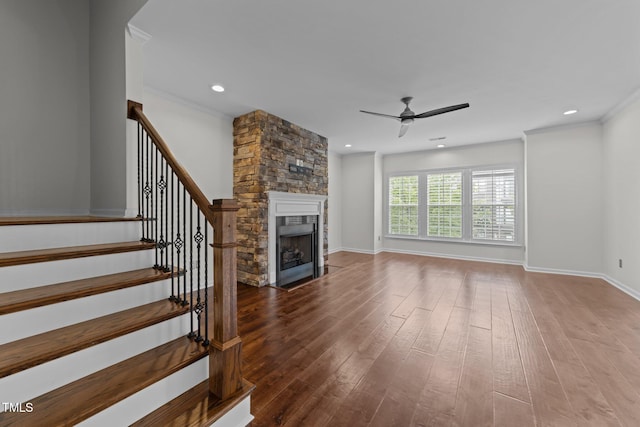 9164 Wooden Rd, Raleigh, NC 27617 - unfurnished living room featuring a ceiling fan, a fireplace, dark wood finished floors, stairs, and recessed lighting