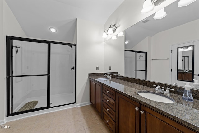 9164 Wooden Rd, Raleigh, NC 27617 - bathroom with a shower stall, double vanity, vaulted ceiling, tile patterned flooring, and baseboards