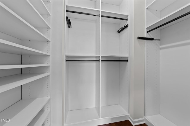 9164 Wooden Rd, Raleigh, NC 27617 - walk in closet featuring dark wood-type flooring