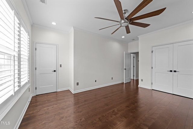 9164 Wooden Rd, Raleigh, NC 27617 - unfurnished bedroom with multiple windows, dark wood-style flooring, crown molding, baseboards, and recessed lighting