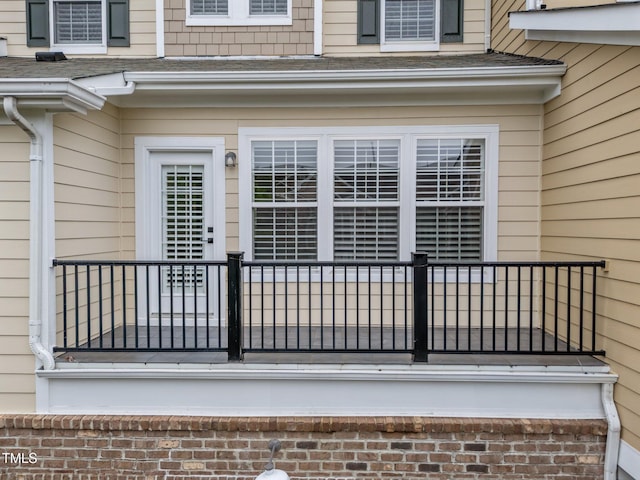 9164 Wooden Rd, Raleigh, NC 27617 - view of exterior entry with a shingled roof