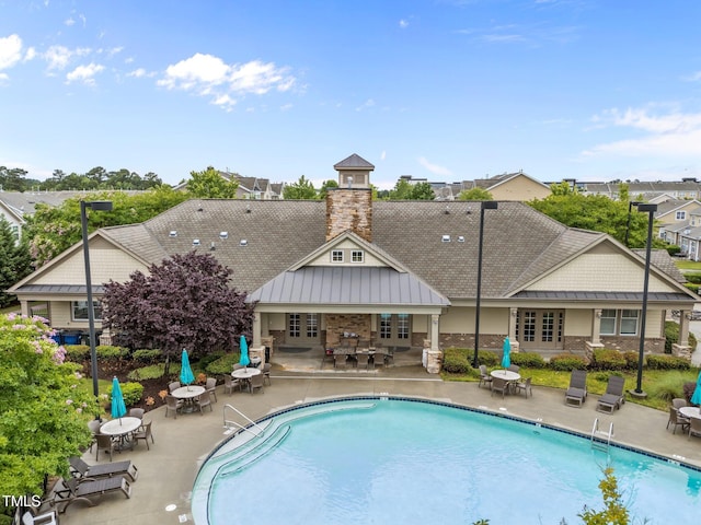9164 Wooden Rd, Raleigh, NC 27617 - view of swimming pool with a patio area, french doors, and outdoor dining space