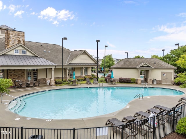 9164 Wooden Rd, Raleigh, NC 27617 - community pool with a patio area