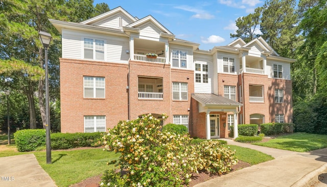 1700 Tiffany Bay Ct Unit 303, Raleigh, NC 27609 - view of front facade featuring brick siding and a front yard