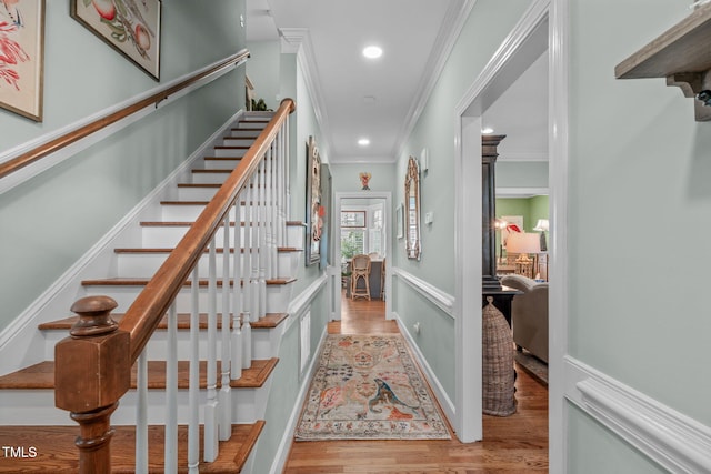 1813 Carrington Dr, Raleigh, NC 27615 - stairway featuring wood finished floors, crown molding, and recessed lighting