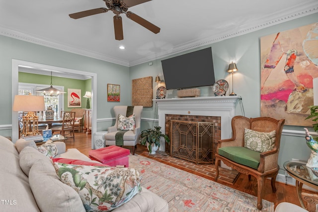 1813 Carrington Dr, Raleigh, NC 27615 - living area featuring crown molding, a ceiling fan, recessed lighting, and a fireplace