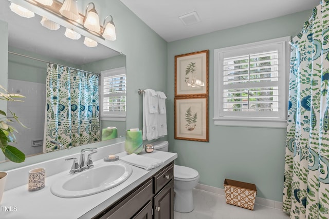 1813 Carrington Dr, Raleigh, NC 27615 - full bathroom featuring vanity, toilet, baseboards, and a shower with shower curtain