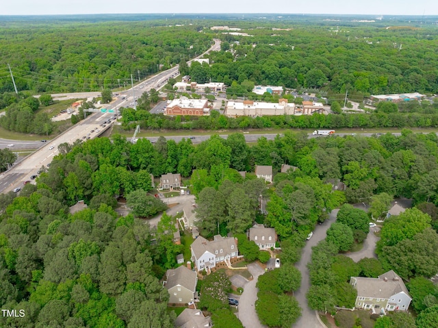 1813 Carrington Dr, Raleigh, NC 27615 - aerial view of property and surrounding area with a heavily wooded area