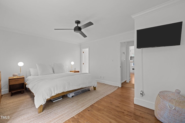 1706 Rangecrest Rd, Raleigh, NC 27612 - bedroom featuring baseboards, crown molding, wood finished floors, and a ceiling fan