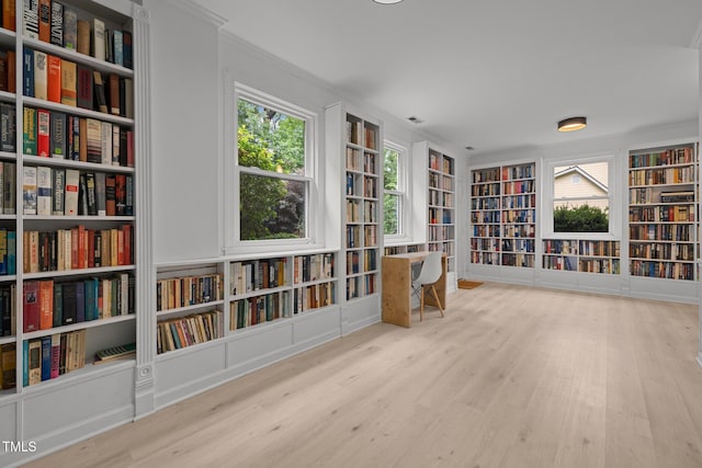 1706 Rangecrest Rd, Raleigh, NC 27612 - unfurnished room featuring bookshelves, built in features, wood finished floors, and crown molding