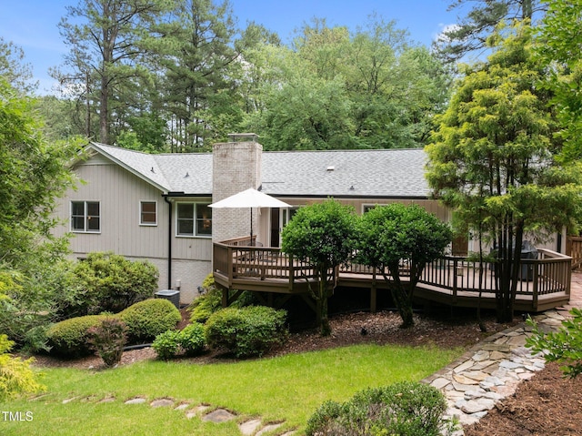 1706 Rangecrest Rd, Raleigh, NC 27612 - rear view of house featuring a deck, a chimney, and roof with shingles