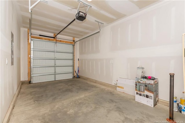 garage featuring a garage door opener and baseboards