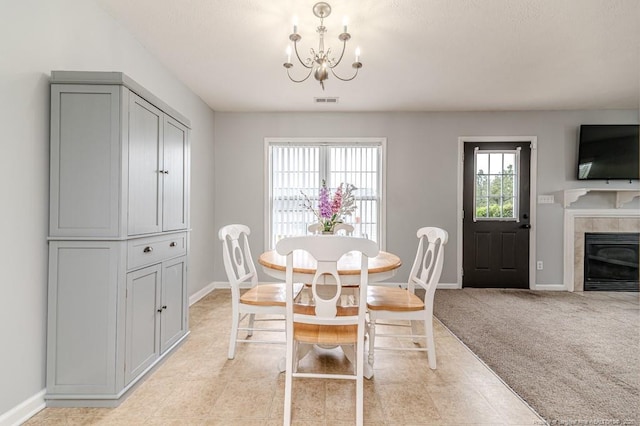 2068 Tingen Rd, Broadway, NC 27505 - dining area featuring a chandelier, baseboards, and a fireplace