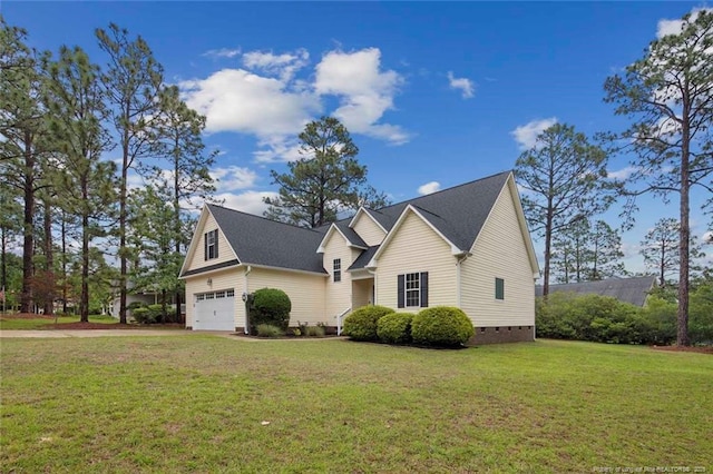 view of front of property featuring crawl space, a garage, and a front lawn