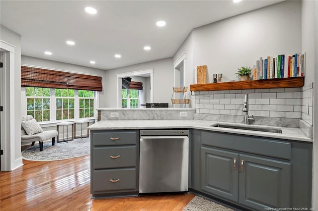 kitchen with gray cabinetry, a sink, stainless steel dishwasher, open shelves, and recessed lighting