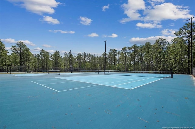 view of tennis court with fence