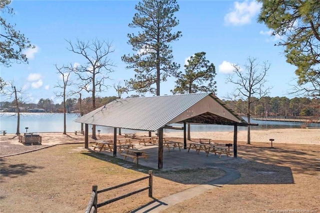 view of home's community with a gazebo and a water view
