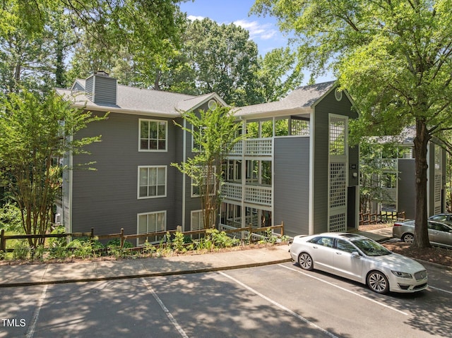 4631 Timbermill Ct Unit 203, Raleigh, NC 27612 - view of building exterior with uncovered parking