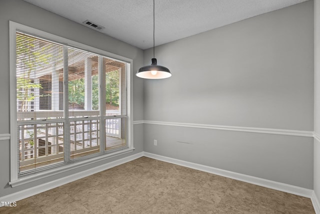4631 Timbermill Ct Unit 203, Raleigh, NC 27612 - unfurnished room with a textured ceiling and baseboards