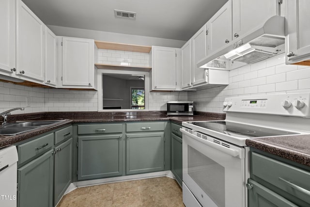 4631 Timbermill Ct Unit 203, Raleigh, NC 27612 - kitchen featuring white appliances, under cabinet range hood, a sink, white cabinetry, and dark countertops