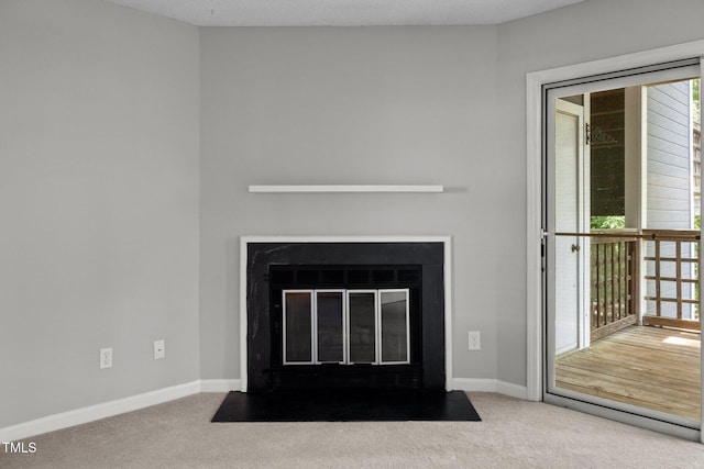 4631 Timbermill Ct Unit 203, Raleigh, NC 27612 - detailed view of carpet, a fireplace with flush hearth, and baseboards