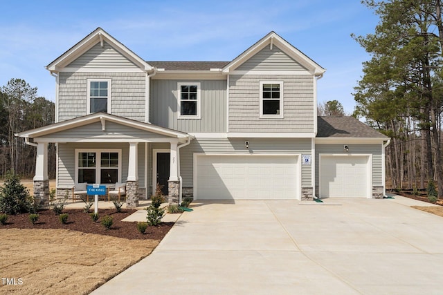 27 Cribbs Ln, Middlesex, NC 27557 - craftsman-style home with covered porch, driveway, stone siding, a garage, and an attached garage