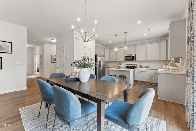 27 Cribbs Ln, Middlesex, NC 27557 - dining room with a chandelier, light wood-style floors, recessed lighting, and baseboards