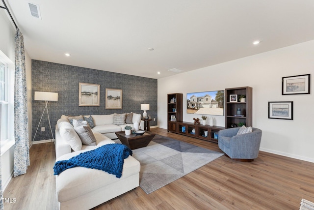 27 Cribbs Ln, Middlesex, NC 27557 - living room with an accent wall, baseboards, wood finished floors, and recessed lighting
