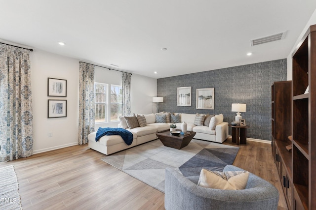 27 Cribbs Ln, Middlesex, NC 27557 - living room with an accent wall, baseboards, wood finished floors, and recessed lighting