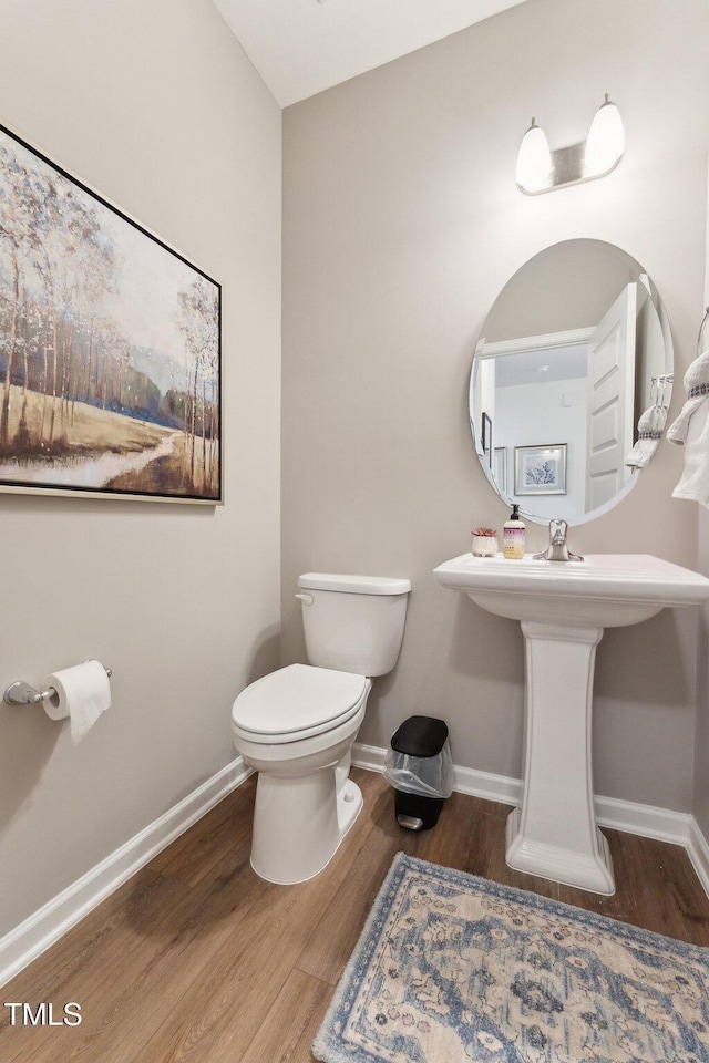 27 Cribbs Ln, Middlesex, NC 27557 - bathroom featuring toilet, wood finished floors, and baseboards