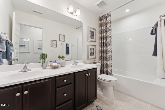 27 Cribbs Ln, Middlesex, NC 27557 - bathroom with tile patterned floors, toilet, double vanity, and shower / bath combination with curtain