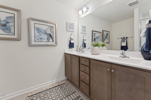 27 Cribbs Ln, Middlesex, NC 27557 - full bath with tile patterned flooring, double vanity, and baseboards