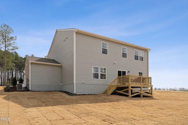 27 Cribbs Ln, Middlesex, NC 27557 - rear view of house with central air condition unit and a deck