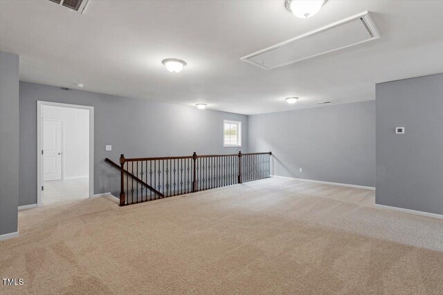 1213 Treetop Meadow Ln, Wake Forest, NC 27587 - spare room featuring attic access, carpet, and baseboards
