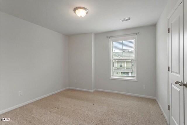 1213 Treetop Meadow Ln, Wake Forest, NC 27587 - spare room with light carpet and baseboards