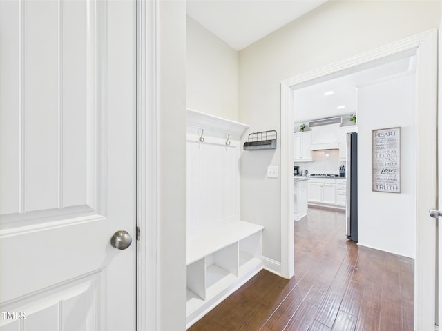 mudroom with dark wood finished floors