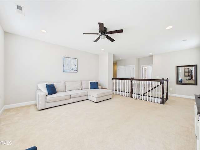 living room with light colored carpet, ceiling fan, baseboards, and recessed lighting