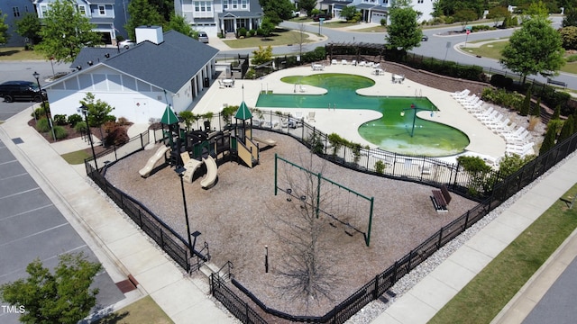 aerial view of residential area featuring a park