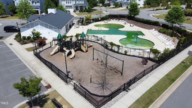 aerial view of residential area featuring a park