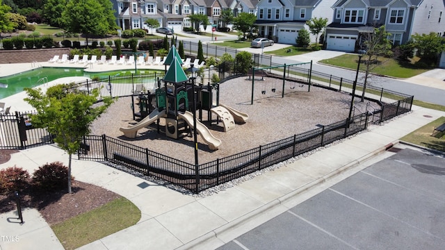 view of property's community with fence and a residential view