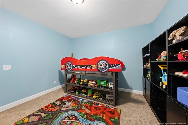 carpeted bedroom with baseboards
