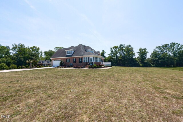 120 Gentle Rain Dr, Garner, NC 27529 - view of front of home featuring driveway, a front lawn, a porch, and an attached garage