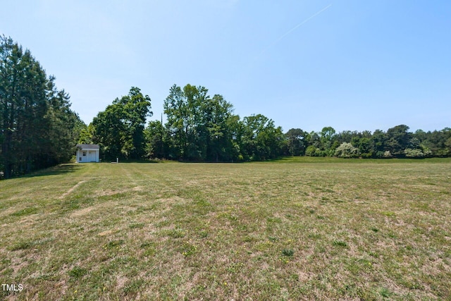 120 Gentle Rain Dr, Garner, NC 27529 - view of green lawn with a view of trees