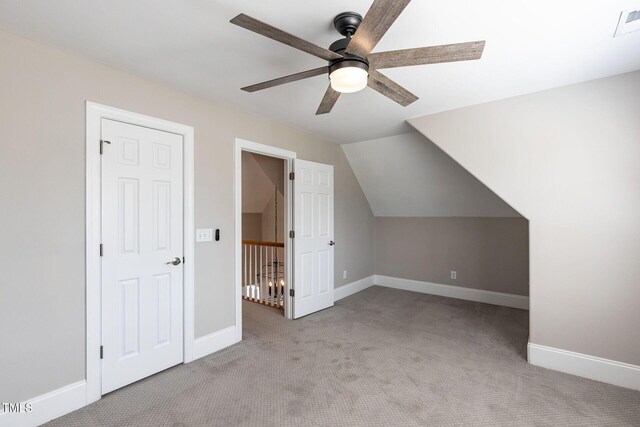 120 Gentle Rain Dr, Garner, NC 27529 - additional living space with a ceiling fan, carpet, baseboards, and lofted ceiling